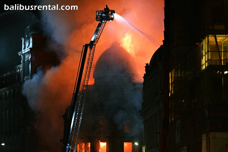 Fire fighters work to control a large fire in Glasgow City centre